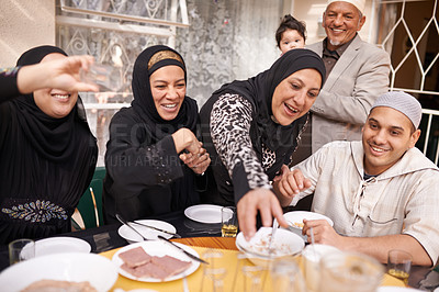 Buy stock photo Muslim family, food and happy at lunch by table for eating, conversation and celebration on Eid. Islamic people, culture and special event with meal for nutrition, discussion and religious holiday