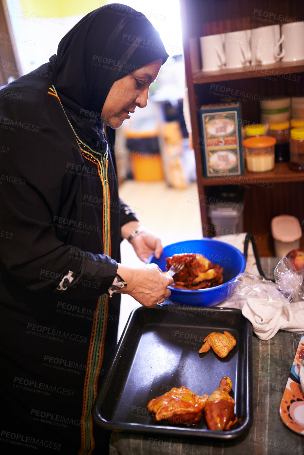 Buy stock photo Muslim woman, cooking or food in kitchen for family dinner or malay spice for arabic cuisine. Islam mother or meal preparation of chicken for grill, hijab or islamic tradition or female role in home