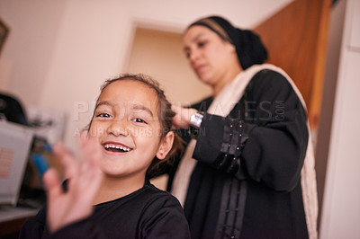 Buy stock photo Mother, girl and muslim with smile, headscarf and support for eid celebration and culture. Islamic family, kid and bonding together for love, growth and happiness with parenting and traditional hijab