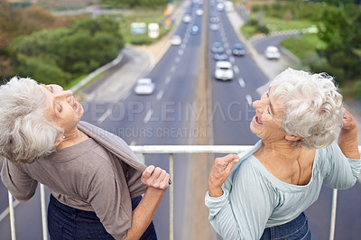 Buy stock photo Two senior women flashing their chests at passers-by