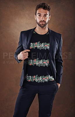 Buy stock photo Spanish male, model and fashion portrait in studio, stylish and isolated on brown background. Clothing, confidence and backdrop space with pose, casual and trendy outfits for cool mens apparel. 