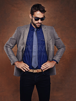 Buy stock photo Stylish businessman, sunglasses and model in studio for corporate fashion, brown background and man aesthetic. In office style, man and confidence in workplace, trendy outfits and mockup space. 