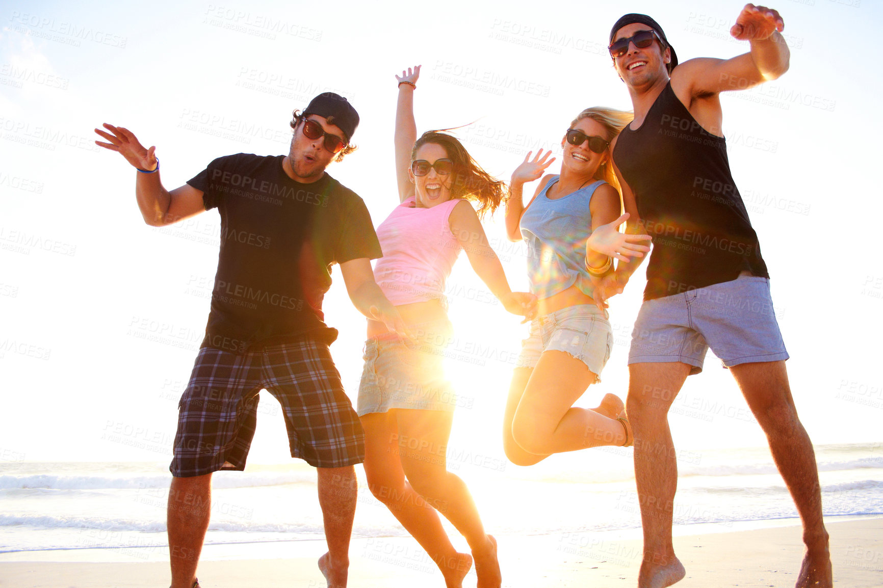 Buy stock photo Friends, jump and beach portrait in sunset with freedom, youth and happiness on vacation together. Excited men, women and smile outdoor by ocean, sunshine and waves in summer, holiday and happy group