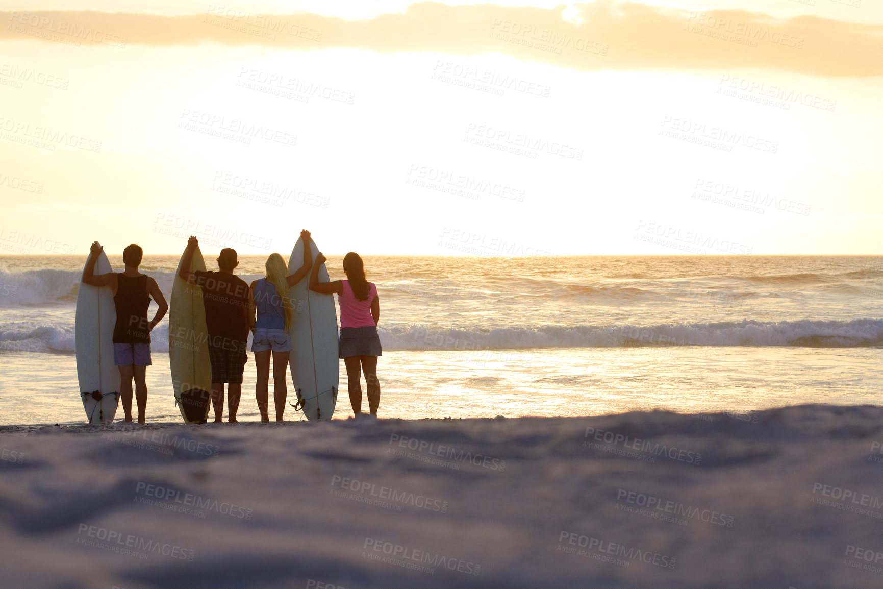 Buy stock photo Surfer group, silhouette and sunset with space for mockup at beach for freedom, youth and nature. People, women and men outdoor by ocean, sunshine or waves in summer, holiday and relax with surfboard