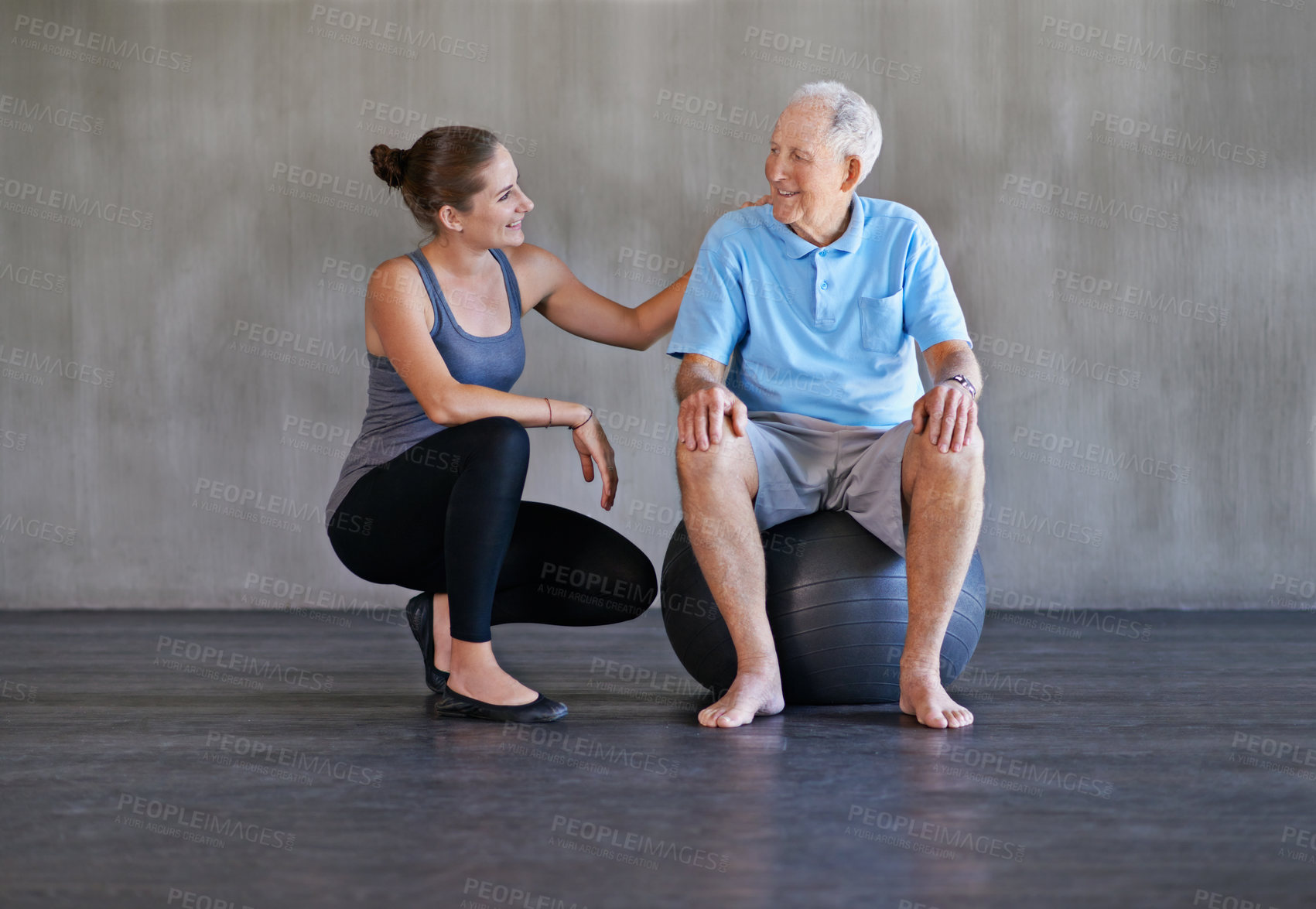 Buy stock photo Shot of a a physical therapist working with a senior man