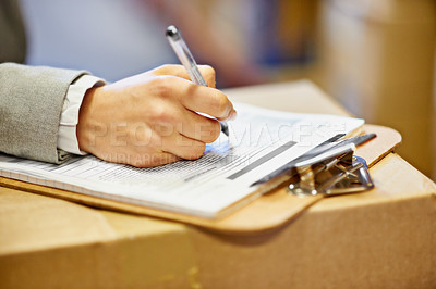 Buy stock photo Inspector, clipboard and closeup of hand writing in warehouse for inventory, quality control and freight distribution. Logistics, person and wholesale supplier with stock checklist for box inspection