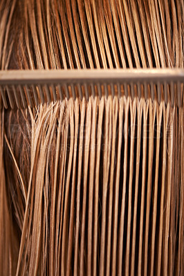 Buy stock photo A view of a comb running through long blonde hair