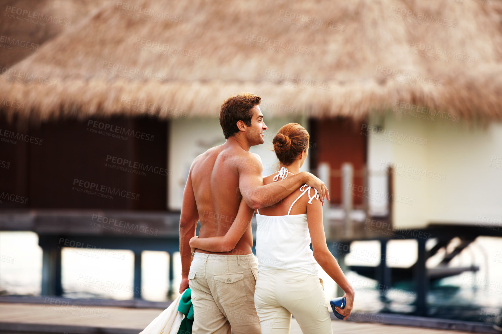 Buy stock photo Happy couple, bonding and relax on vacation on island, back and honeymoon in summer for love. Man, woman and walking in embrace at beach resort, peace and romantic holiday for marriage in thailand