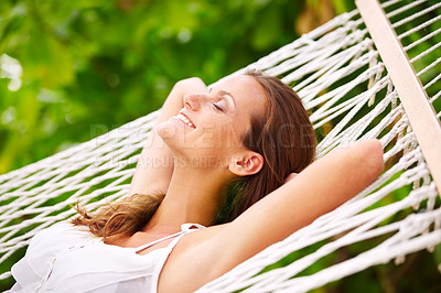 Buy stock photo Happy woman, rest and wellness on hammock in outdoor, peace and summer vacation in sunshine in nature. Young person, smile and sleep by trees at beach resort, calm and holiday for leisure on island