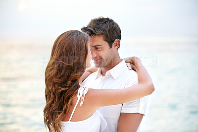 Buy stock photo Happy couple, love and hug by ocean in nature, support and relax on honeymoon adventure in outdoor. Young man, woman and smile for bonding in marriage, sea and travel on summer getaway in cape town