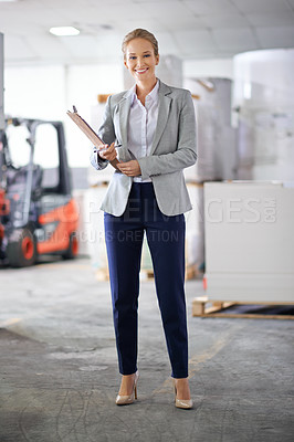 Buy stock photo Businesswoman, suit and smile with clipboard in warehouse for paperwork and administration. Portrait, female person and happy for stock or information capture in logistics company as entrepreneur 