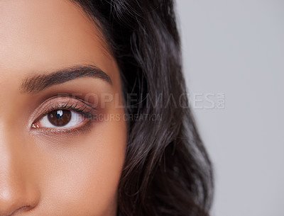 Buy stock photo Woman, closeup and skin with eye, portrait and natural beauty for skincare confidence. Model, confident and body or hair care with cosmetics, vision or trendy style isolated on grey studio background