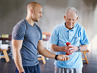Buy stock photo Physiotherapist, senior man patient and weight training for health and wellness therapy in retirement. Healthcare, physio and workout for recovery with dumbbell for medical rehab and elderly person