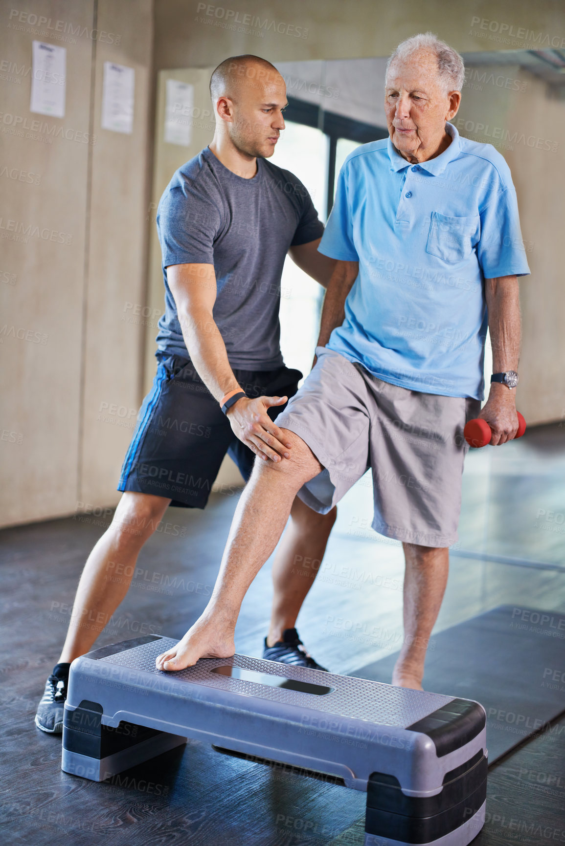 Buy stock photo Cropped shot of a handsome personal trainer with a senior man