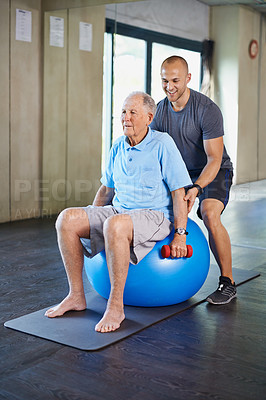 Buy stock photo Cropped shot of a handsome personal trainer with a senior man