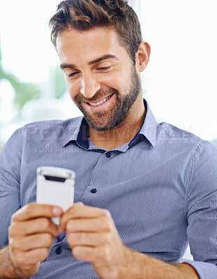 Buy stock photo Business man, phone and check an email in home, communication and networking for company. Male person, smile and reading a notification on app for conversation, website and internet for information
