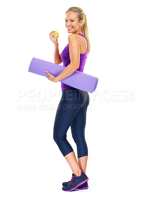 Buy stock photo Woman, portrait and apple with yoga mat in studio, smile and pilates for fitness on white background. Female person, happy and fruit for minerals or vitamins, wellness and healthy diet for fiber