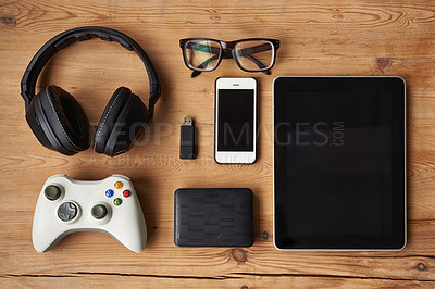 Buy stock photo High angle shot of wireless technology on a wooden table