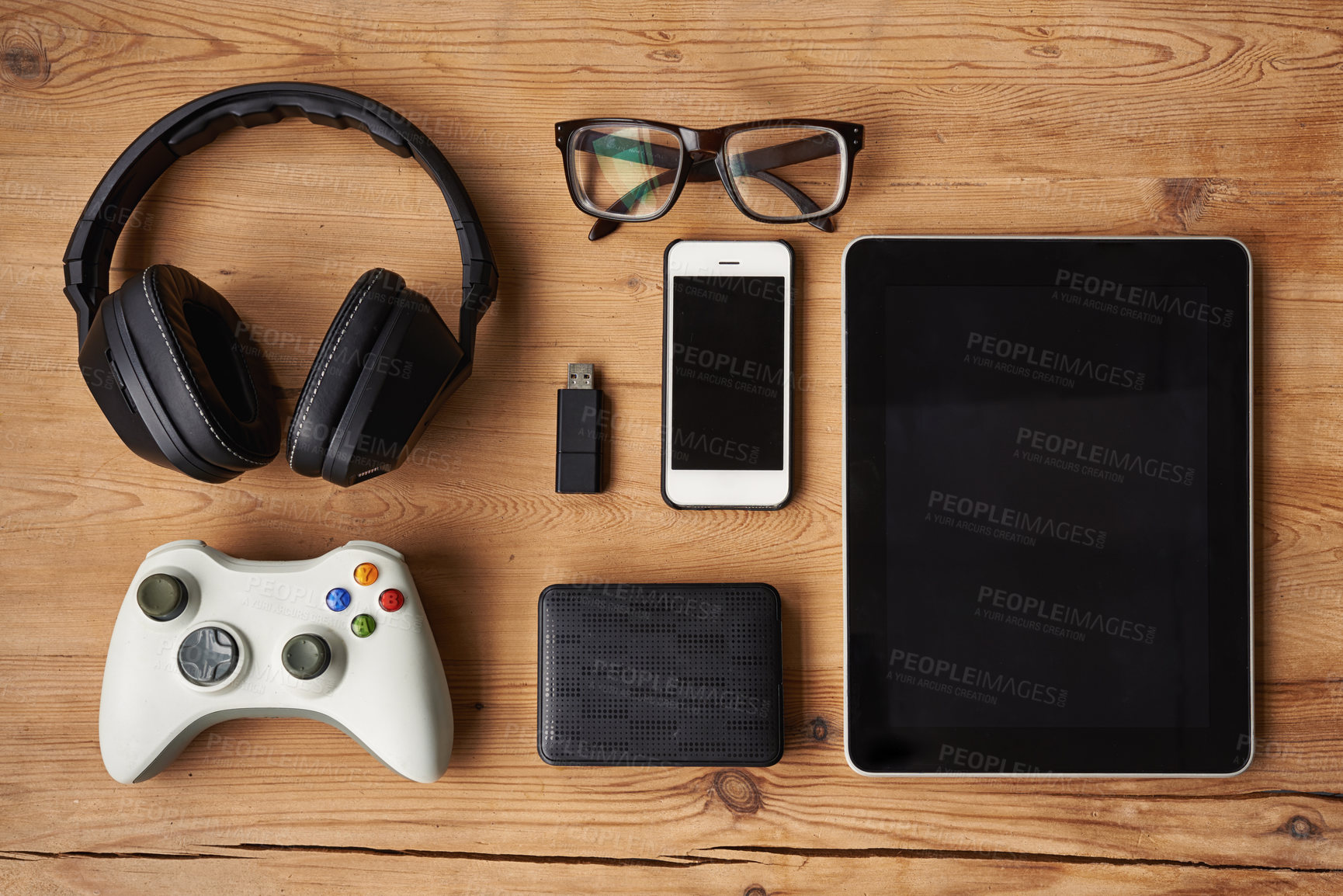 Buy stock photo High angle shot of wireless technology on a wooden table