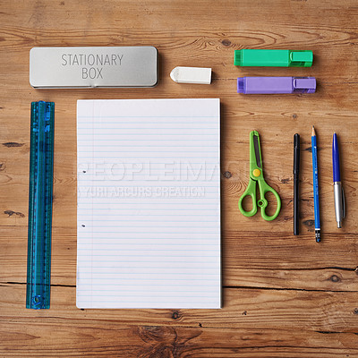 Buy stock photo Desk, notebook and stationery for school project or assignment on creative art, design and drawing. Wooden table, supplies and pen for writing exams or test with blank page for ideas and planning 