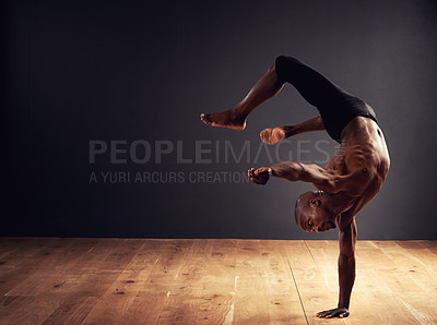 Buy stock photo Male dancer performing an acrobat move
