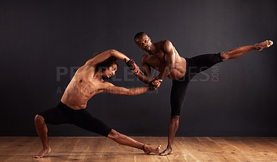 Buy stock photo Performance, theatre and moving of men for dance, creative and art of body, team and passion. Black background, male people and partners with pride, confident and balance for ballet and stage