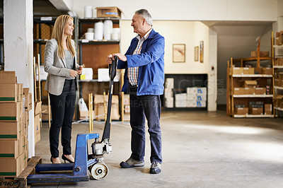 Buy stock photo Man, woman and management in distribution warehouse, supply chain and logistics industry with pallet jack for boxes. Shipping, supplier and storage facility for delivery and inventory with discussion