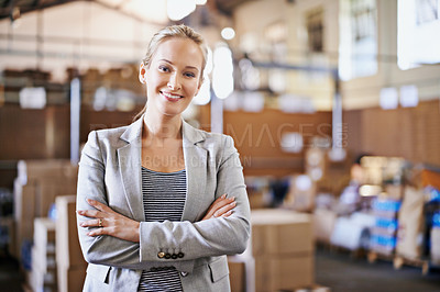 Buy stock photo Woman, smile and crossed arms for portrait in warehouse for logistics, shipping or distribution. Business person, happy and confident in factory with production for supply chain industry in Liverpool