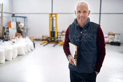 Buy stock photo Portrait of a male foreman standing on the factory floor with a clipboard