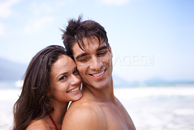 Buy stock photo Love, hug and portrait of happy couple at beach for tropical holiday adventure, relax and bonding together. Nature, man and woman smile on romantic date with ocean, blue sky and embrace on vacation.