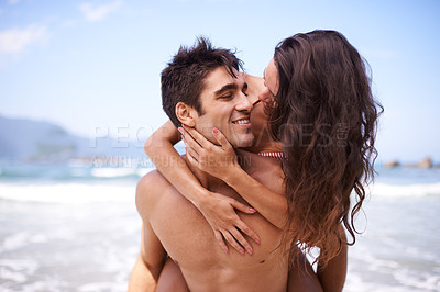 Buy stock photo Love, piggy back and happy couple at ocean for tropical holiday adventure, relax and bonding together. Nature, man and woman smile on romantic date with beach, blue sky and embrace on island vacation