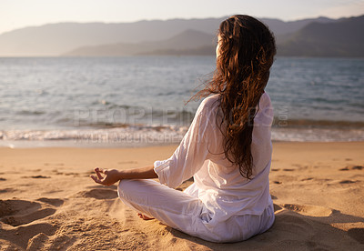 Buy stock photo Back view, woman and meditation on beach with lotus pose, mindfulness and zen with fresh air for calm outdoor. Ocean, breeze and travel with yoga for health, peace of mind and holistic healing 