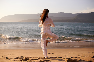 Buy stock photo Beach, meditation or woman in nature at sunset for peace, zen or mental health wellness. Spiritual, balance or back of female person at the ocean for energy, breathing or holistic self care at sea