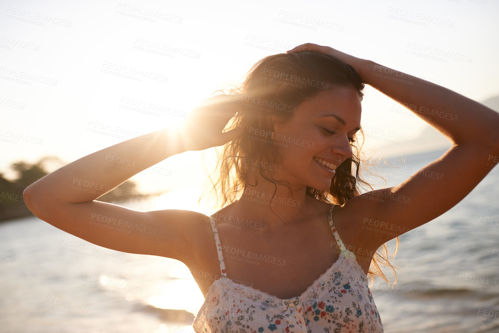 Buy stock photo Cropped shot of a beautiful young woman on the beach