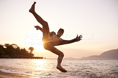 Buy stock photo Man, dancing and breakdance with jump on beach for hip hop performance, workout training and practice. Ocean, dancer and movement with energy with sunset, stunt or flexible talent on Maldives holiday