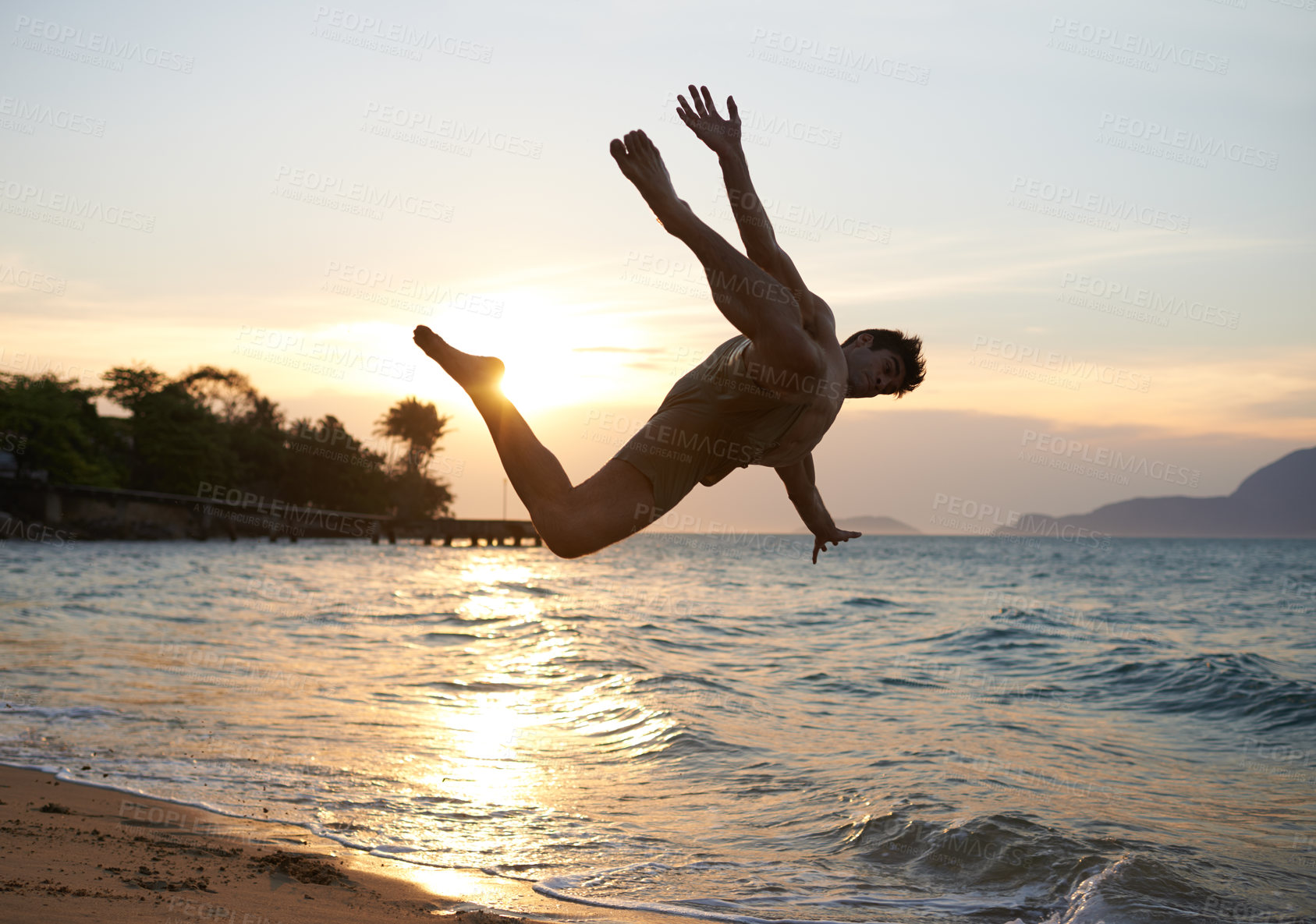 Buy stock photo Man, dancer and breakdance with jump on beach for hip hop performance, workout training and practice. Ocean, dancing and movement with energy at sunset, stunt or flexible talent on Maldives holiday