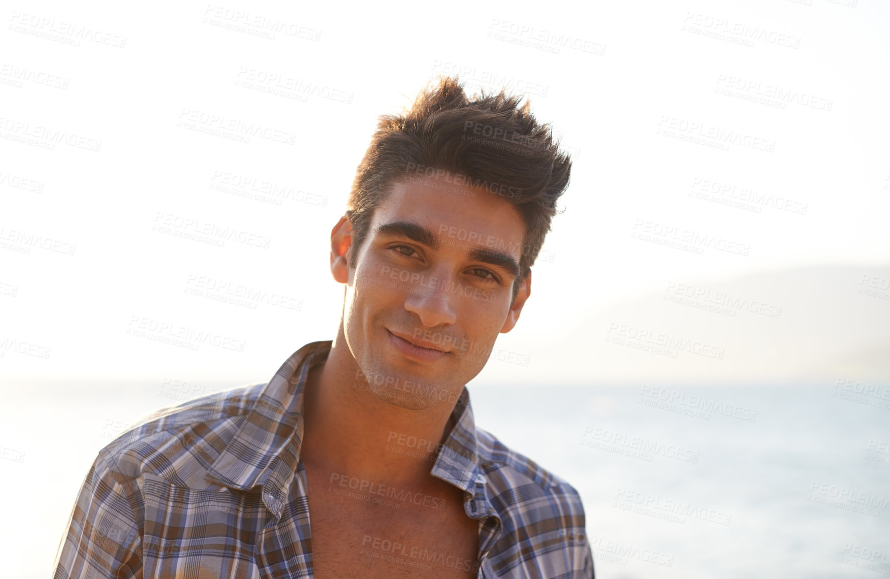 Buy stock photo Man, sexy and travel with fashion, portrait and smile in landscape, confidence and pride. Male person, beach and hot by ocean, coast and tropical for summer, vacation and tourist in Cape Town