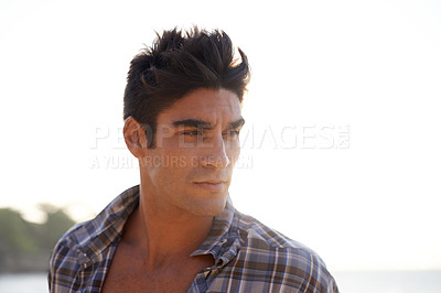 Buy stock photo Greek man, serious and island vacation at sea for beach, trip and thinking outdoors of nature sunset. Male person, tourist and travel for satisfaction at tropical holiday destination in summer