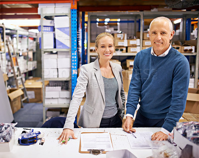 Buy stock photo Shot of managers at work supervising a shipping and distribution business