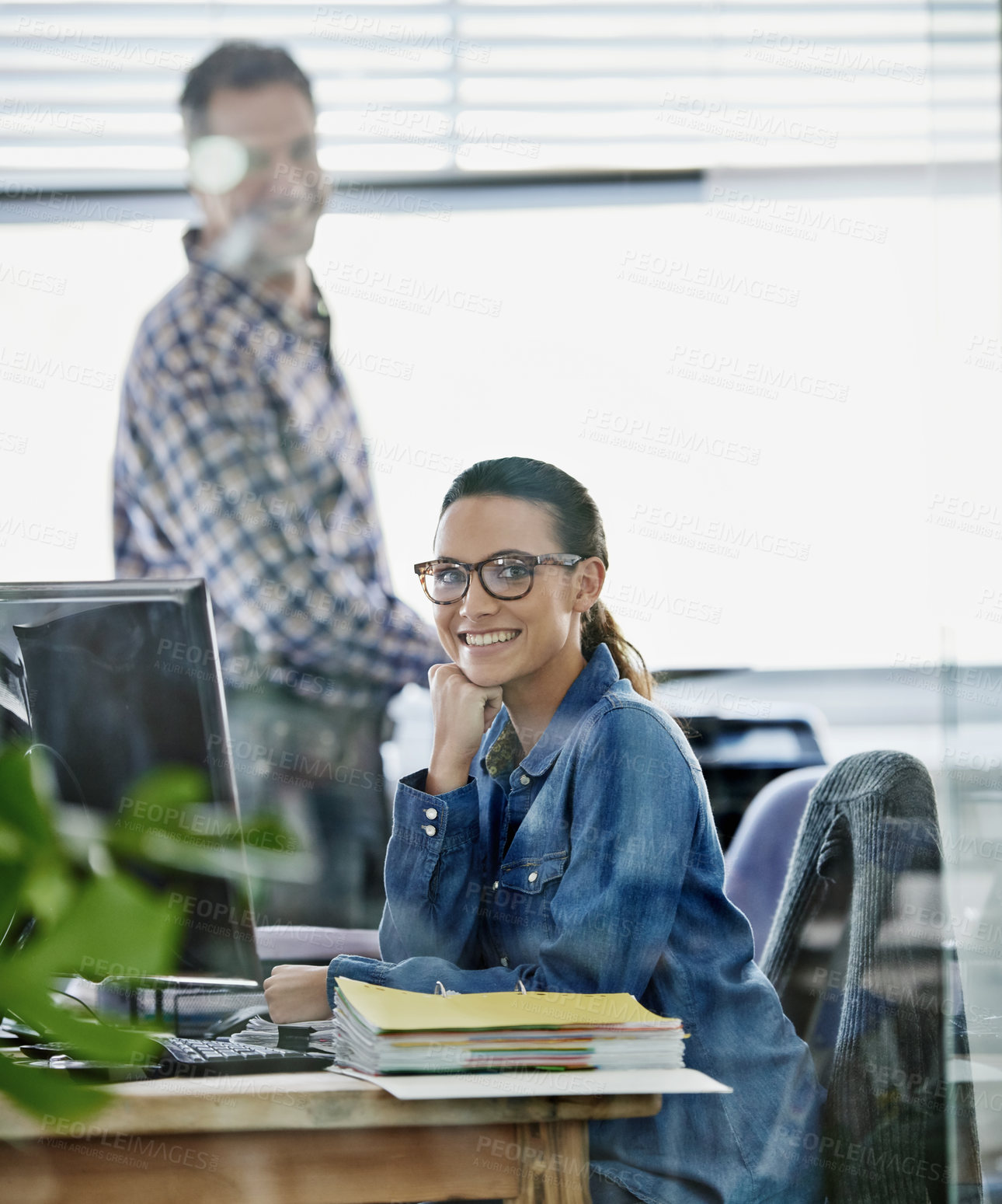 Buy stock photo Cropped portrait of two young designers working on a pc