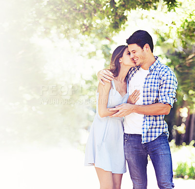 Buy stock photo Couple, happy and summer with kiss in park for love, connection and bonding in San Francisco. Woman, man and smile in nature together for date, holiday or vacation weekend with romantic embrace