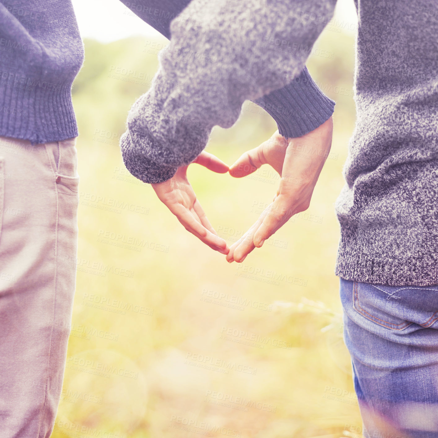 Buy stock photo Heart hands, love and summer with couple in countryside together for trust, safety or romance closeup. Nature, emoji or hand gesture with man and woman outdoor for security or dating from back