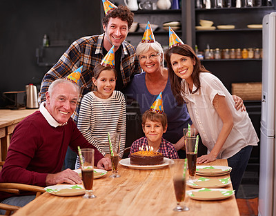 Buy stock photo Portrait of a happy young boy celebrating his birthday with his family