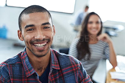 Buy stock photo Portrait of two smiling coworkers sitting at their computers