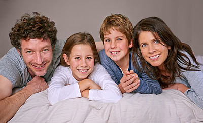 Buy stock photo Portrait, bed and family with children, love and relax with fun and happiness with joy and morning. Face, bedroom or parents with kids or cheerful with vacation or bonding together with weekend break