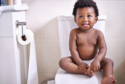 Buy stock photo African baby boy, toilet and home with smile, learning and childhood development for potty training. Young toddler, black child or kid sitting in bathroom with diaper, growth and looking in house