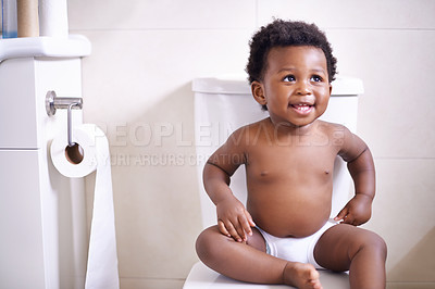Buy stock photo Baby boy, toilet and smile in house, learning and African childhood development with potty training. Young toddler, black child or kid sitting in bathroom with diaper, growth and happiness in home