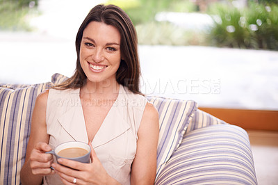 Buy stock photo Woman, coffee and home in sofa with smile on break or relax for wellbeing, day off and enjoy. Portrait, female person and happy in living room on couch with cup on holiday, calm and chill in lounge 