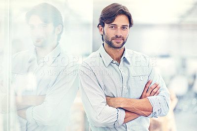 Buy stock photo Businessman, portrait and confident by glass background as professional, reflection and happy in career in studio. Designer, face or arms crossed with creativity in startup or job pride in workplace