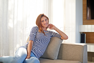 Buy stock photo Relax, sofa and face of woman in house, home and living room with peace or calm and happy to rest for weekend. Female person, gen z girl and lady in apartment, lounge and sitting on couch for break
